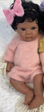 Eden. Newborn. Full Body Silicone Brown Skin Tone, Black Curly Hair: #H5. Open Mouth 18” long 7lbs. Turn Around Time approx. 10 Days.